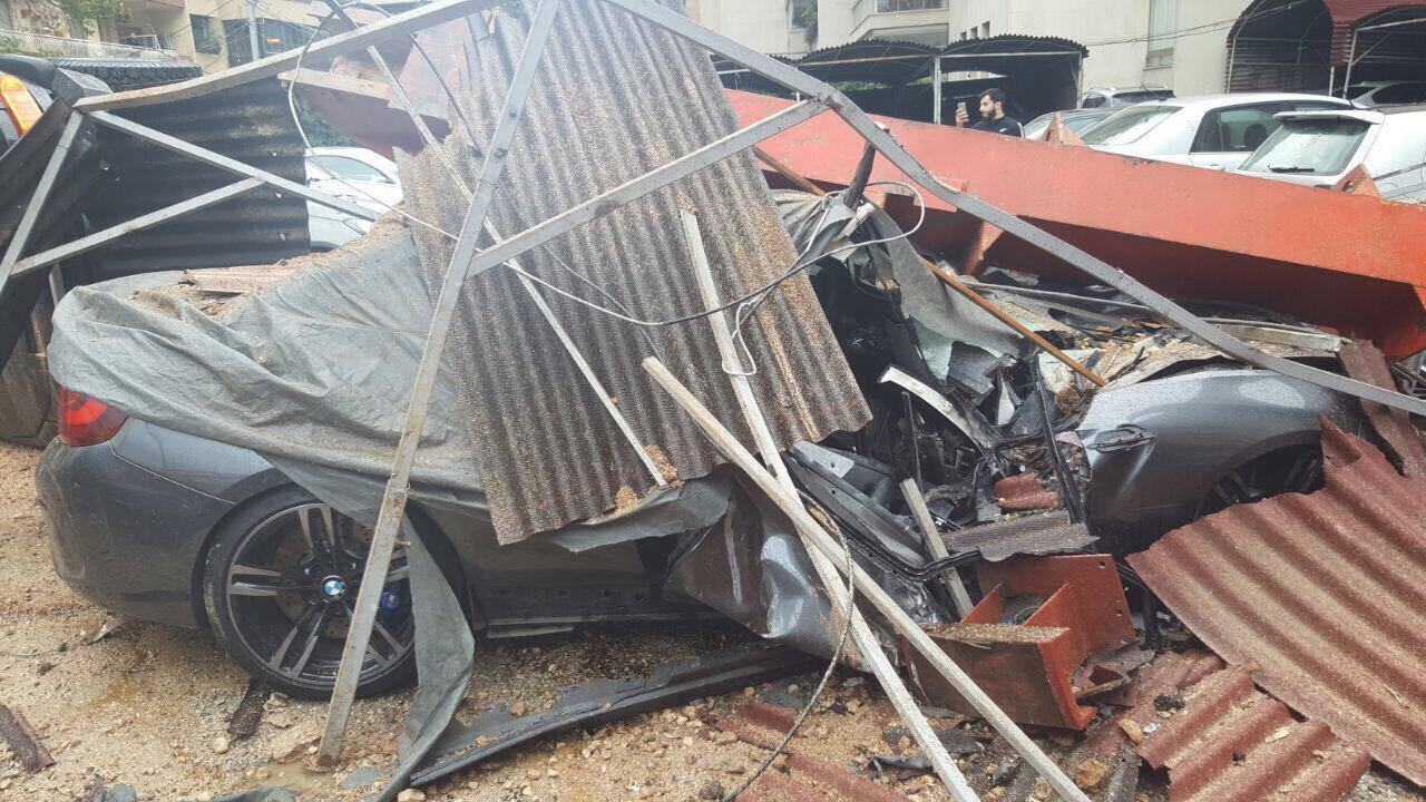 A crane in syoufi near Achrafieh fell because of strong wind damaging cars and balconies near by