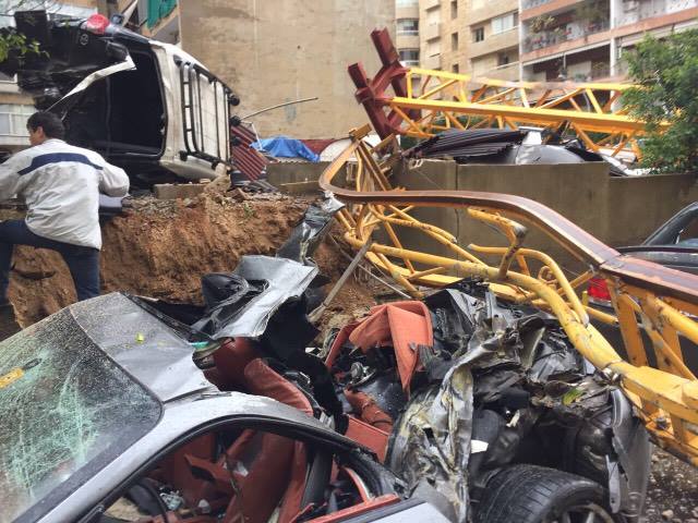 A crane in syoufi near Achrafieh fell because of strong wind damaging cars and balconies near by