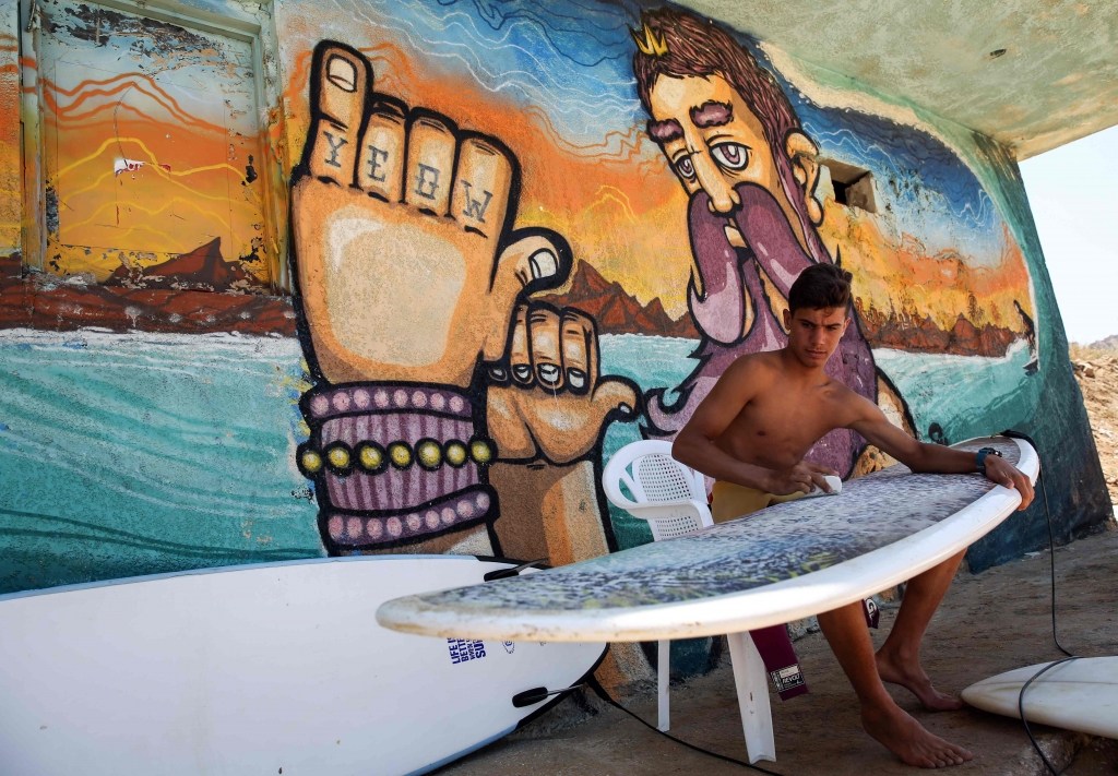 Ali Kassem had never seen the sea before he fled Syria, but now he dreams of his own surf school, Jiyeh, Lebanon, (Joseph Eid / AFP)