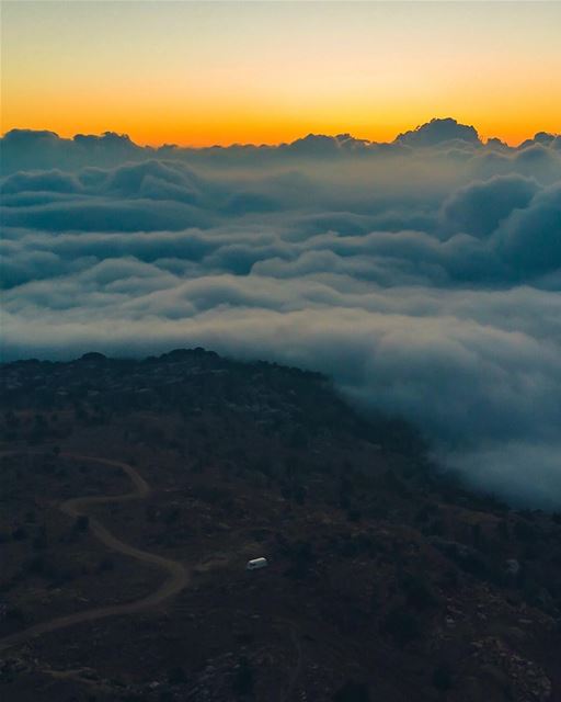 As we stood looking down from the highest peak, we watched as the clouds... (Majdel Tarchich)