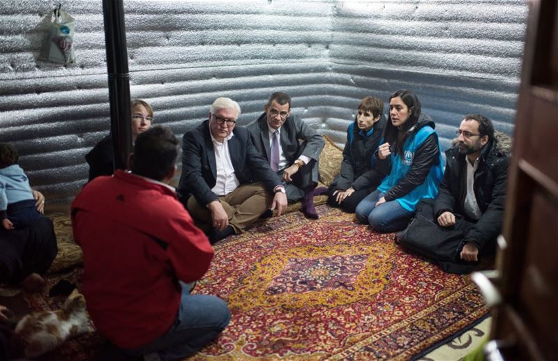 German Foreign Minister Frank-Walter Steinmeier talk with refugees in Saadnayel.