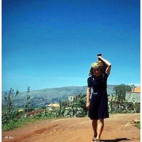 Hammana - May 1948 , Girls Carry potable spring water .