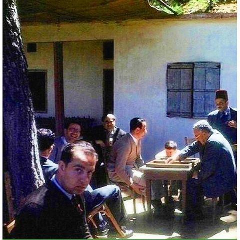 Hammana May 1948 , local residents and their visitor friends play a backgammon in the village coffee shop .