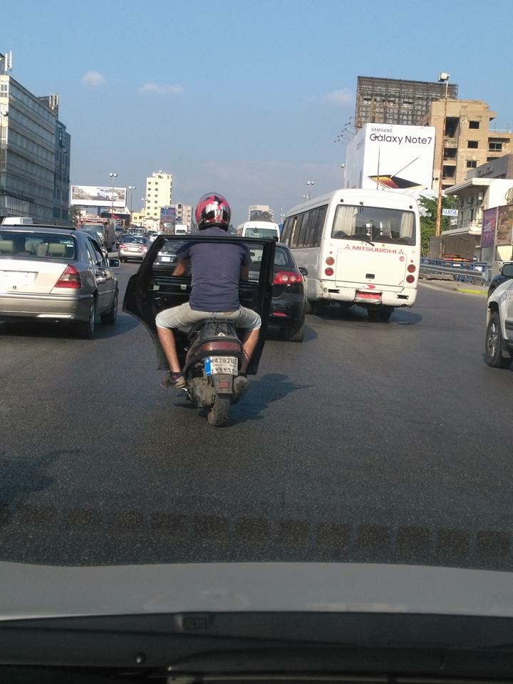 If you don't have a car you might as well put a door on your scooter just to feel good!