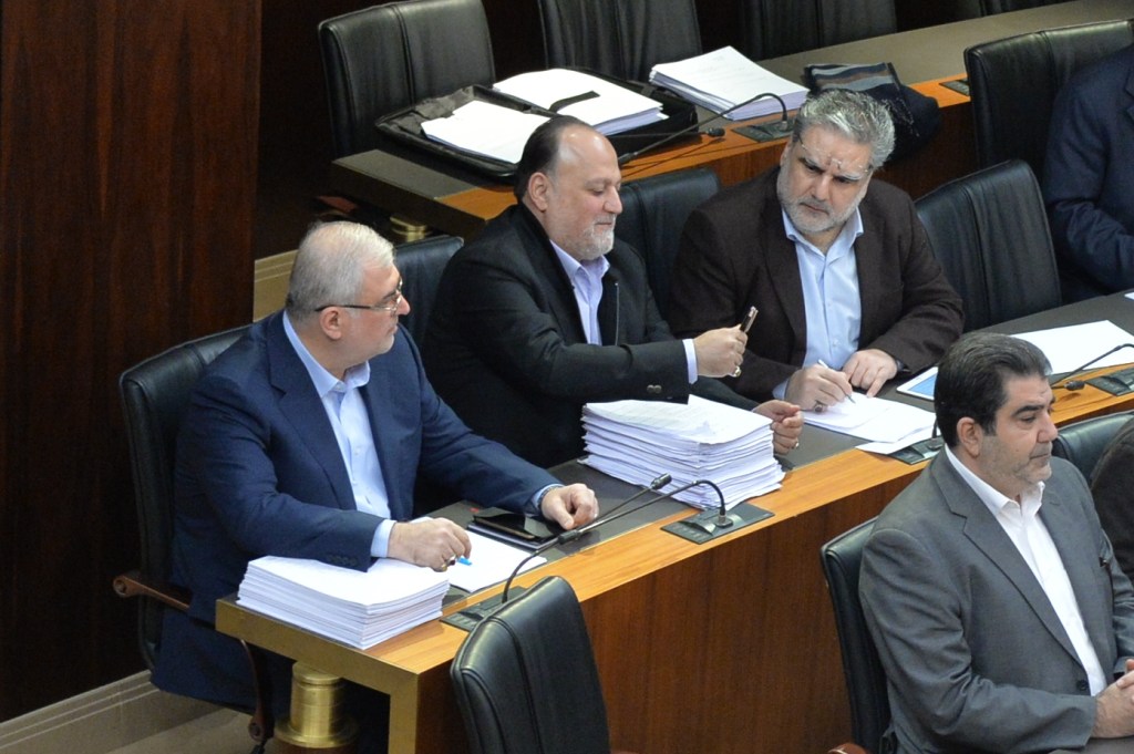 MPs Ali Ammar, Nawaf Mousawi, Mohamad Raad during a legislative session inside the parliament in Beirut. (Hasan Ibrahim / Lebanese Parliament)