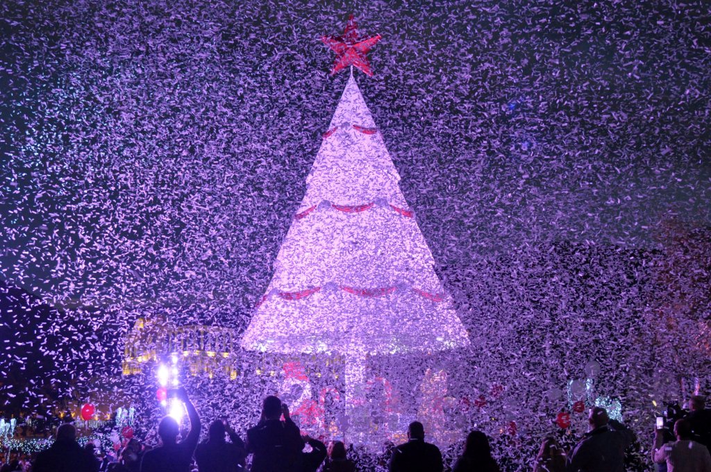 People gather under a Christmas Tree in Zgharta.