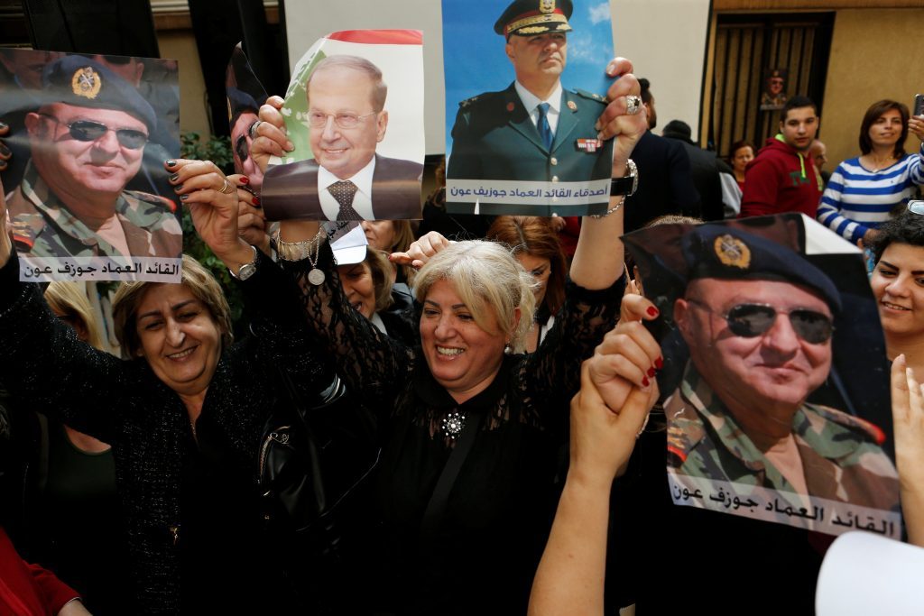 Relatives hold up a pictures of President Michel Aoun and newly-appointed Joseph Aoun as army commander in Sin El Fil. (Mohamed Azakir / REUTERS) via pow.photos