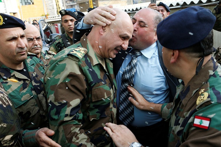 Rice is thrown as people welcome newly appointed Army Commander Joseph Aoun upon at his family’s house in Sin El Fil. (Mohamed Azakir / REUTERS) via pow.photos