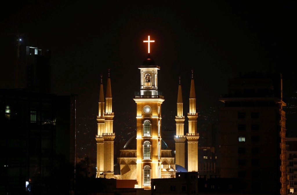 Saint George Maronite Cathedral’s cross is lit during the inauguration of its bell tower in downtown Beirut.