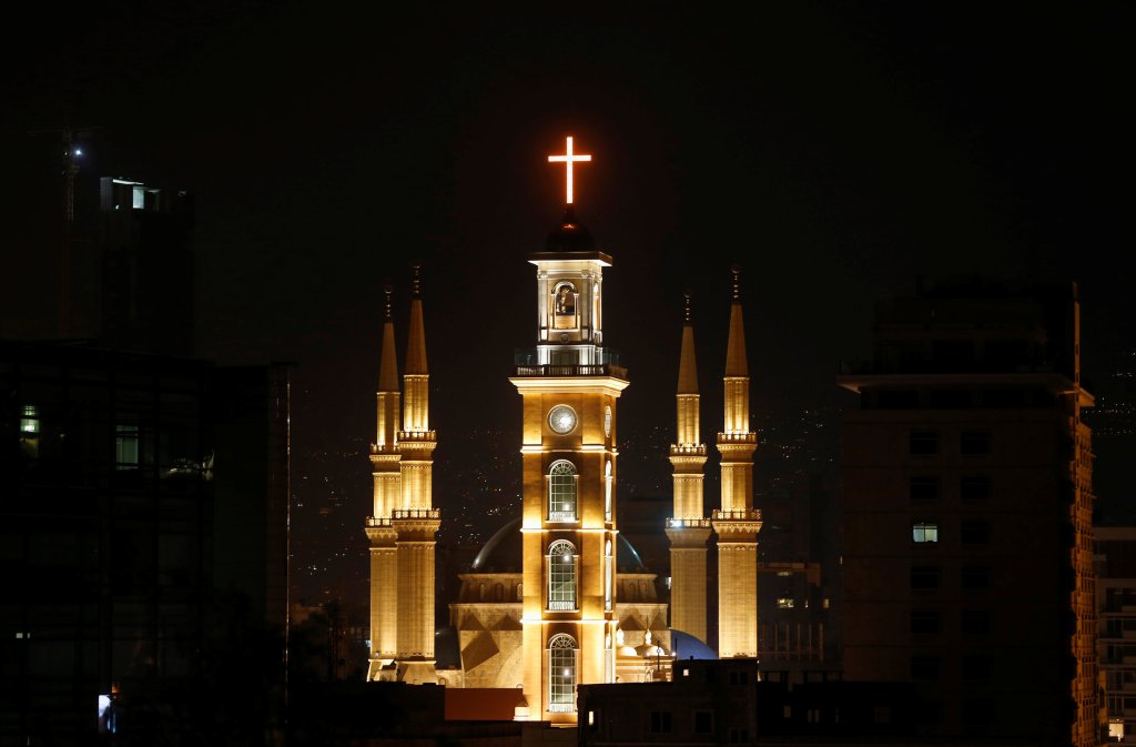 Saint George Maronite Cathedral’s cross is lit during the inauguration of its bell tower in downtown Beirut.