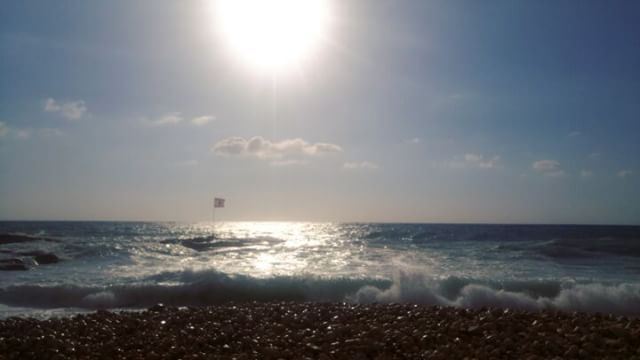  standingstill 🚩🌊... beach  waves  flag  lebanon  batroun  bluesky ...