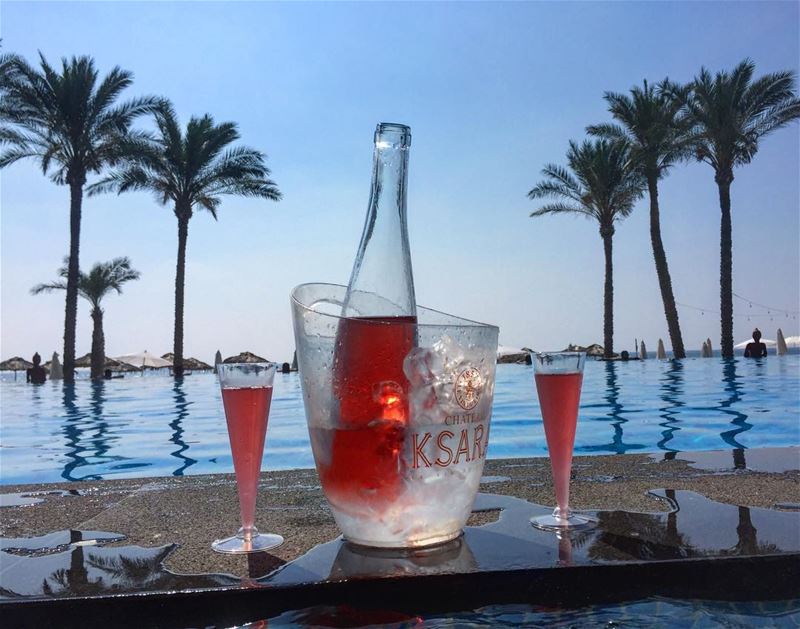 Sunset drinks 👌  lebanesebucketlisters  wine  rose  beach  pool ... (Damour, Lebanon)