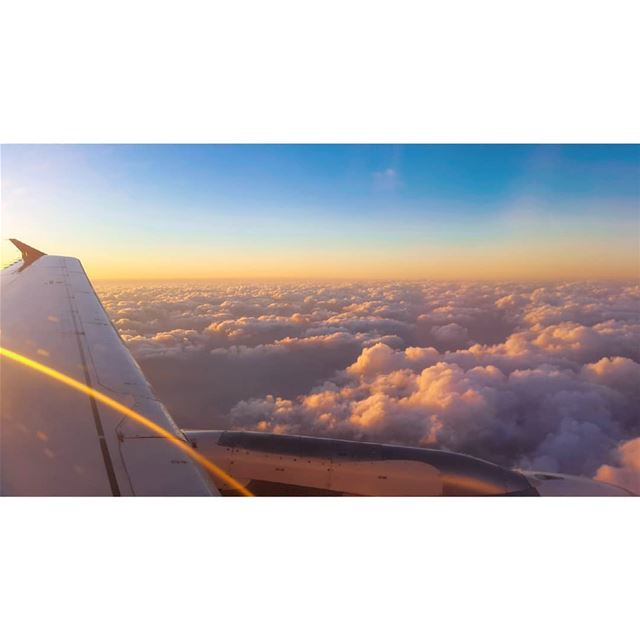  sunset from from above the clouds mesmerizing breathtaking view airplane...