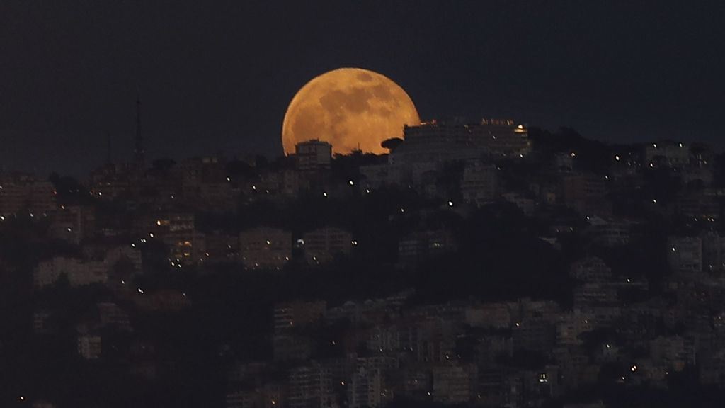 The full Moon of half Ramadan rises behind mount Lebanon. (Hussein Malla)