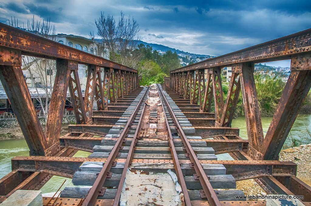 The Rusty Old Train Metal Bridge Passing over the Nahr Ibrahim River in Nahr Ibrahim Town near the Beach