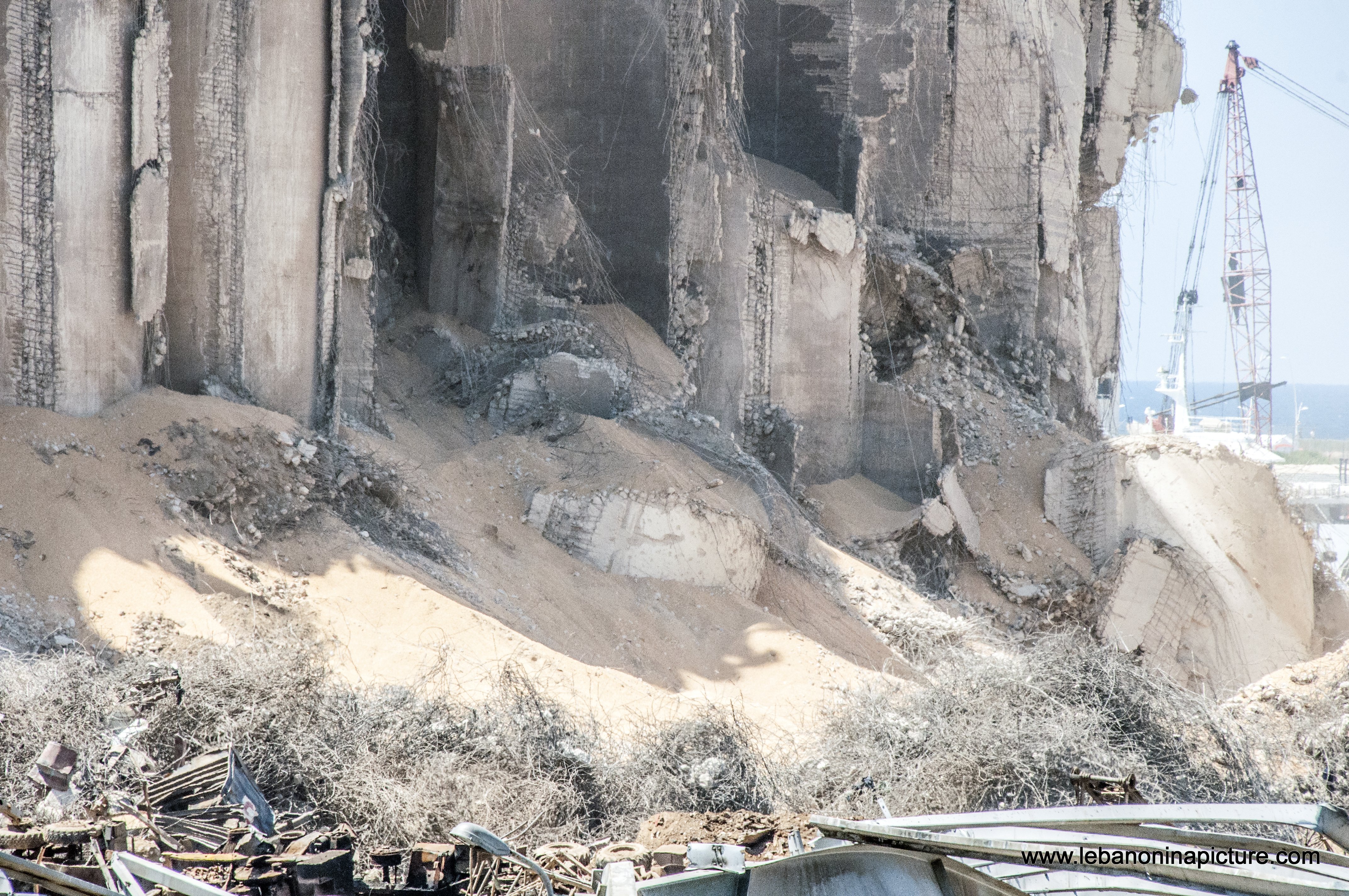 The still standing wheat storage and the explosion area in Beirut Port